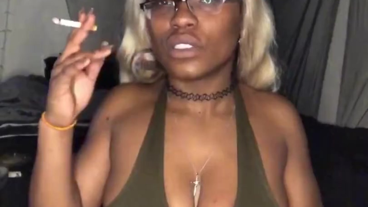 Smoking Milf teases with big tits