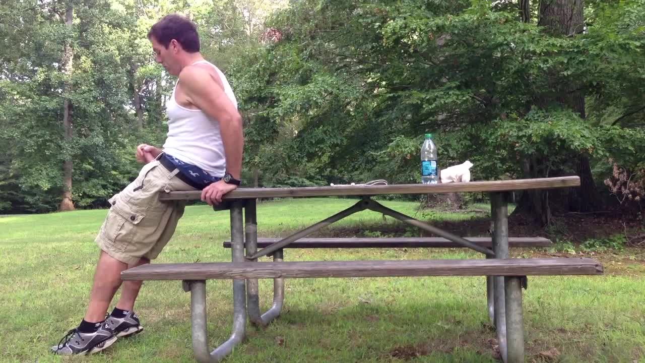 Masturbating in the public park next to the busy road.