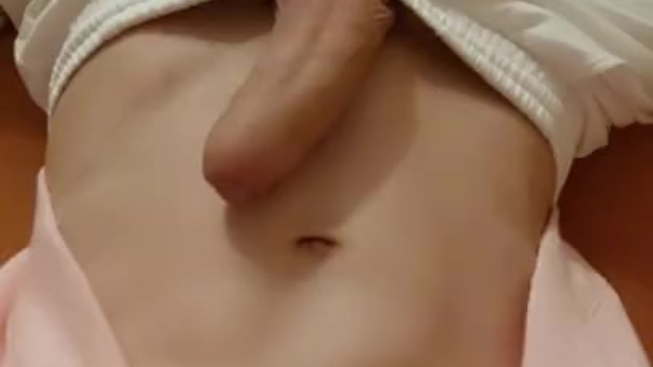 A horny 18-year-old boy masturbates in a pink sweater after waking up