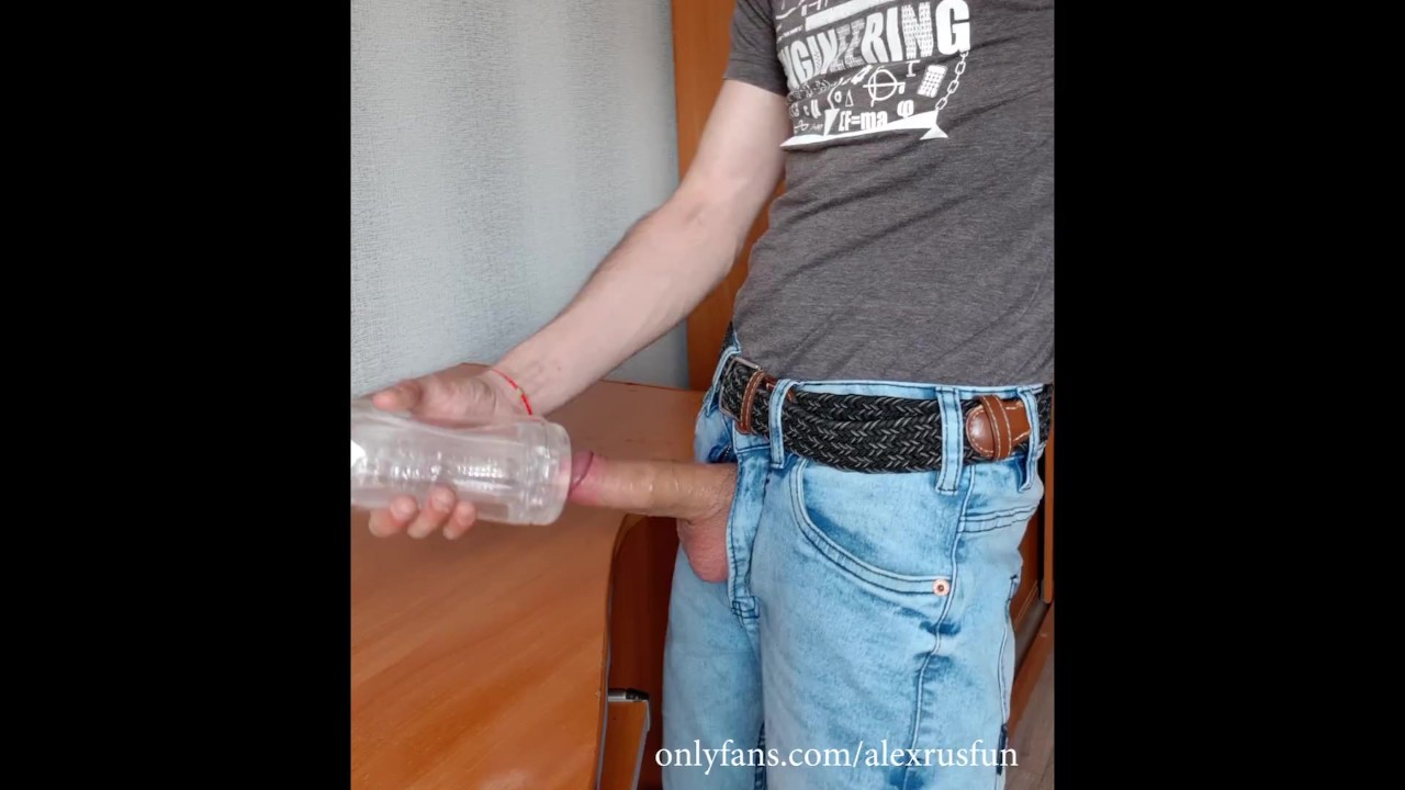 Fit Russian guy in jeans fucks an artificial vagina and cums on the table